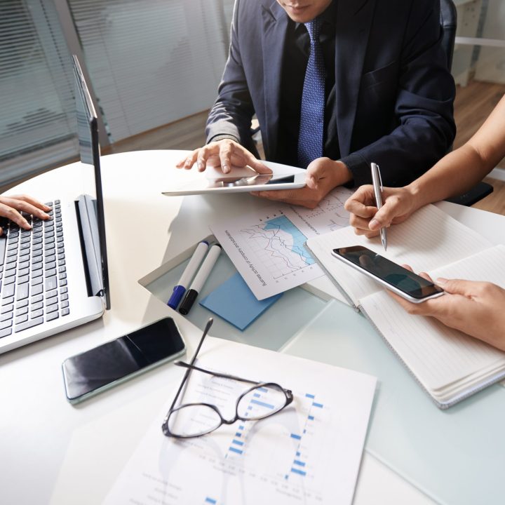 business-people-sitting-office-desk-working-project